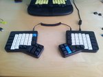 Here we have the ErgoDox on my desk, above lies my Tek parked under the LCD monitor.